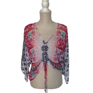 Mesh Bebe top in size small which is cropped in the front and long in the back